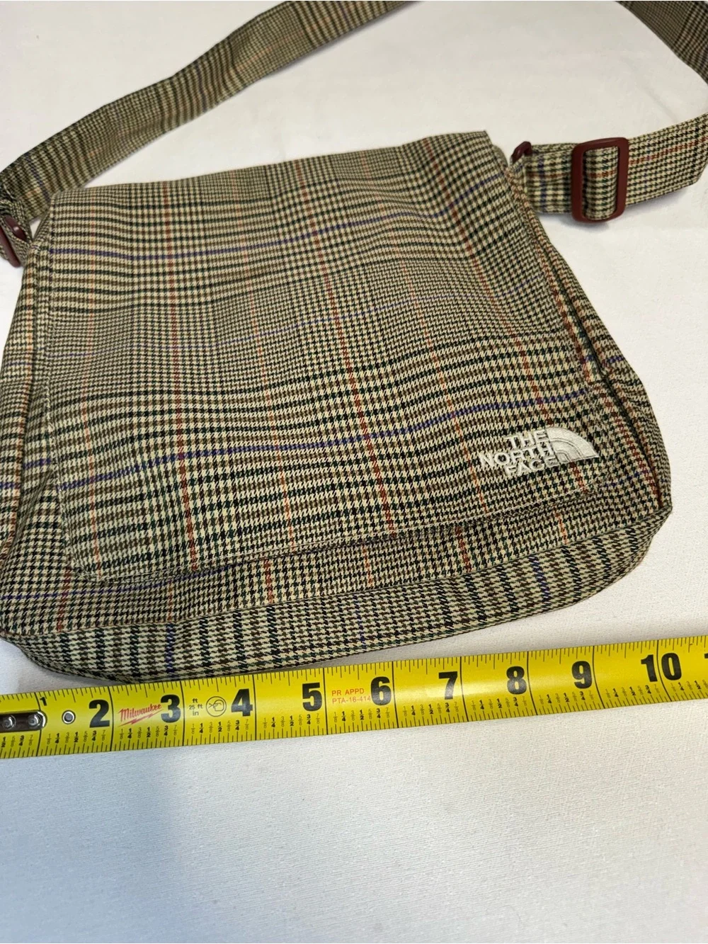 The North Face compact messenger